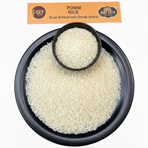Ponni Rice in black bowl and plate – soft and fluffy South Indian rice.